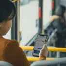 Translink Transit app on woman's phone