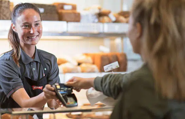 Cashless transaction being made in a bakery in Germany