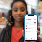 Woman holding phone with Post Office digital ID EasyID app