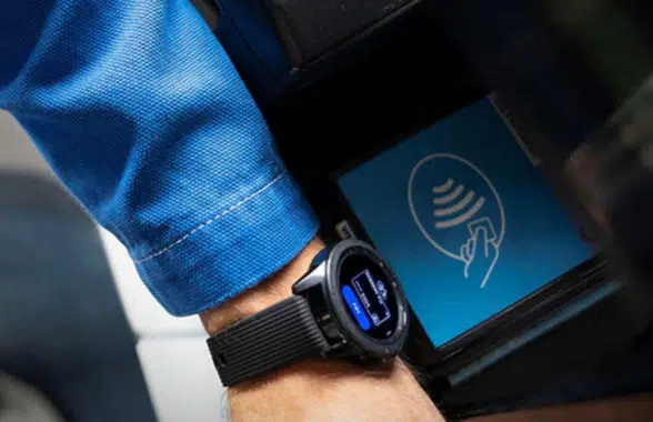 Mobile wallet on a smartwatch being used to make a contactless payment