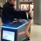 Man accessing contactless retail delivery robot at Cincinnati airport