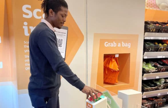 Customer using Sainsbury’s ‘just walk out’ contactless store in London