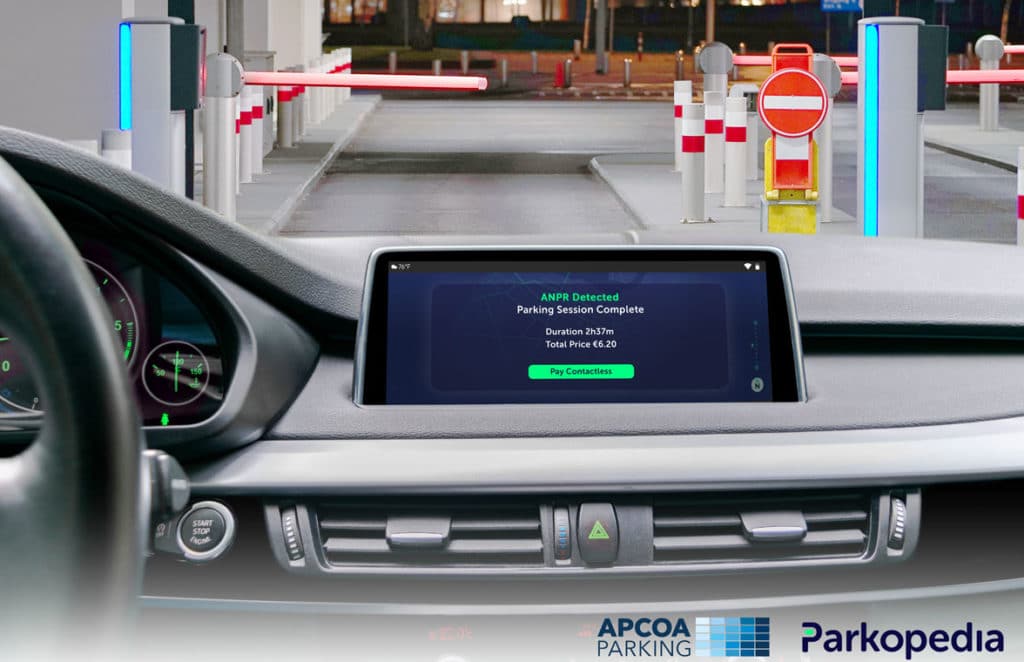 Car dashboard showing APCOA European contactless parking payments system  