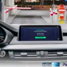 Car dashboard showing APCOA European contactless parking payments system