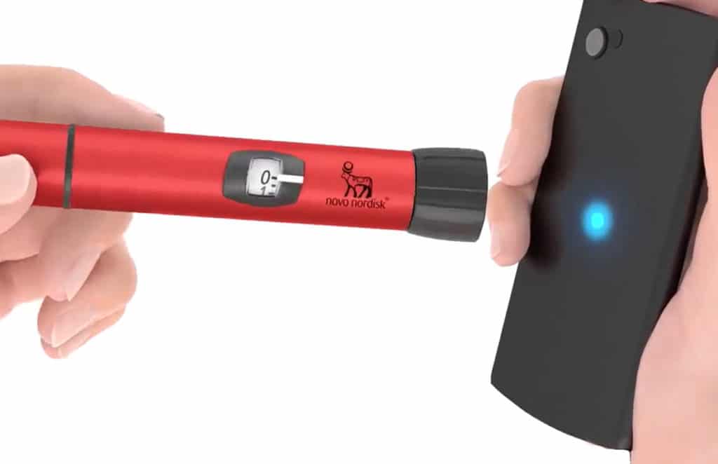 UK NHS NFC insulin pen being used to send information to smartphone