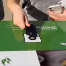 Customer using contactless card to buy from Tortoise robotic mobile smart store in the US