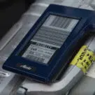 Alaska Airlines NFC bag tag on luggage to speed self check-in