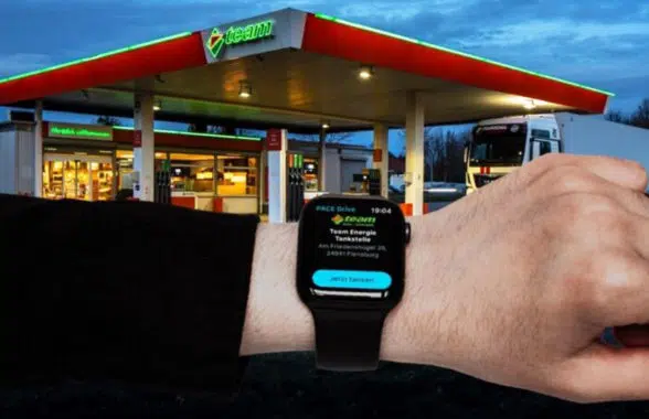 Smartwatch being used to make contactless fuel payments at the pump at Team Energie station in Germany