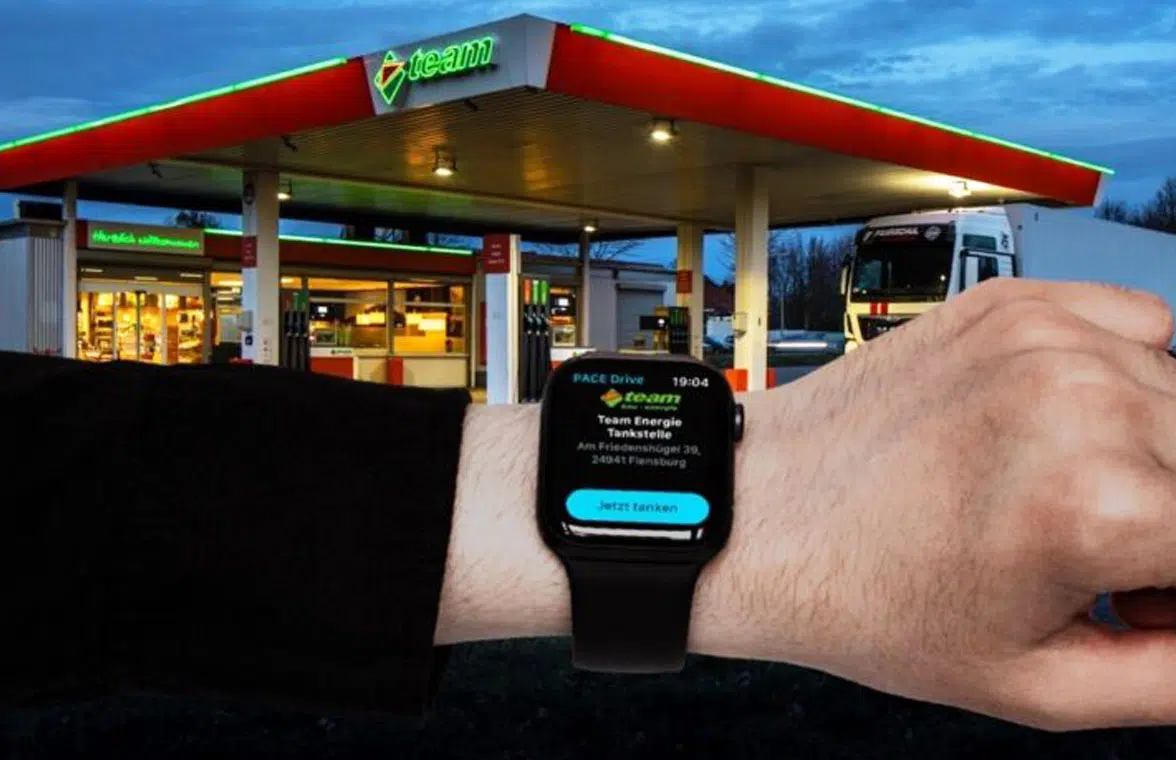 Smartwatch being used to make contactless fuel payments at the pump at Team Energie station in Germany