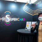 Woman holding smartphone with easycard supercard logo in the background