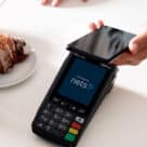 Consumer making mobile payment for face-to-face transaction in Nordic country