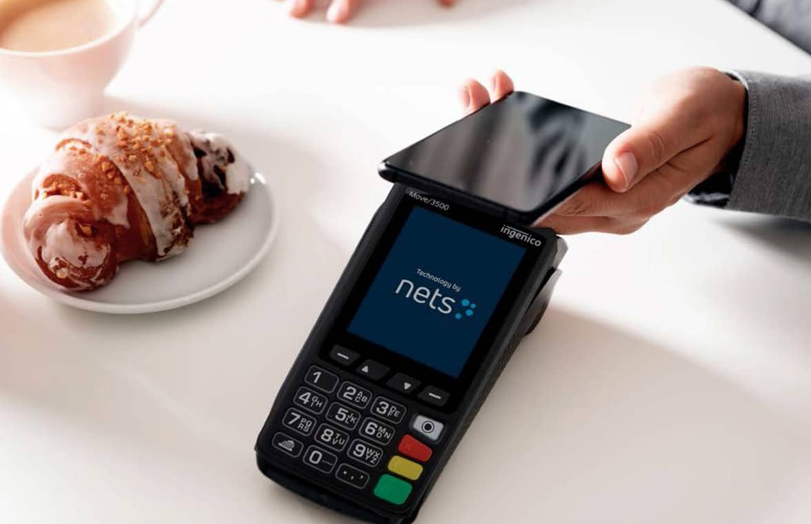 Consumer making mobile payment for face-to-face transaction in Nordic country