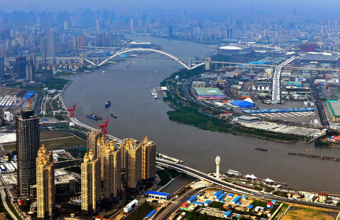 Aerial view of Shanghai, its river and infrastructure