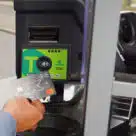 Person paying with contactless card on Translink on Northern Ireland bus