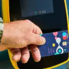 Person making tap-in tap-out open loop contactless fare payment in Amsterdam