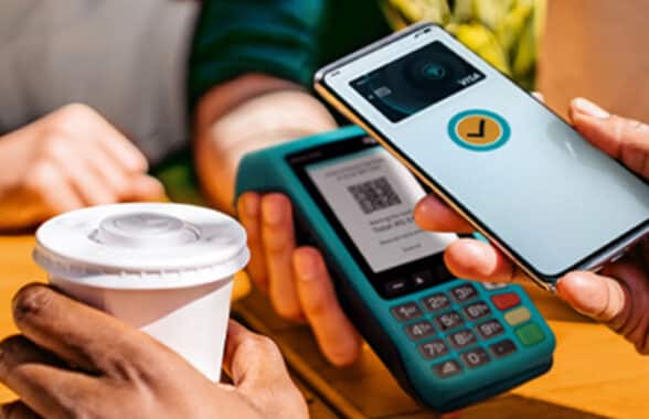 Person making contactless mobile payment with First National Bank digital card in South Africa