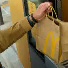 Man picking up order at McDonald’s contactless fast food outlet in Texas