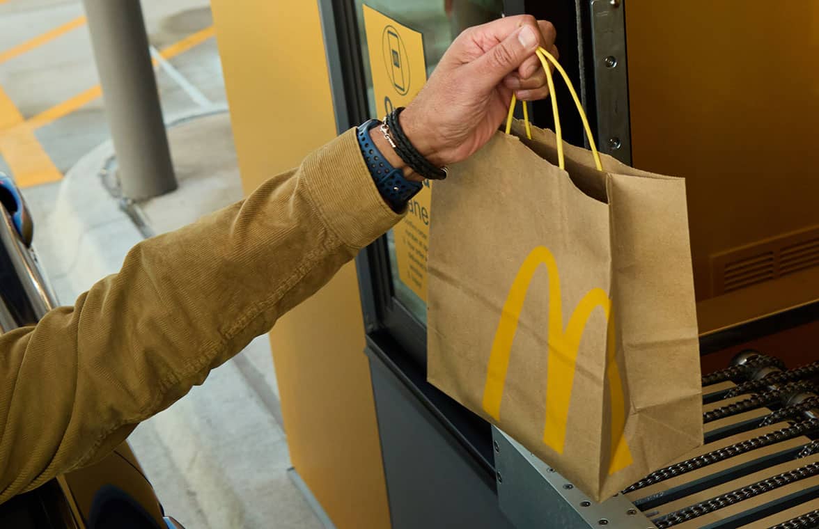 Man picking up order at McDonald’s contactless fast food outlet in Texas
