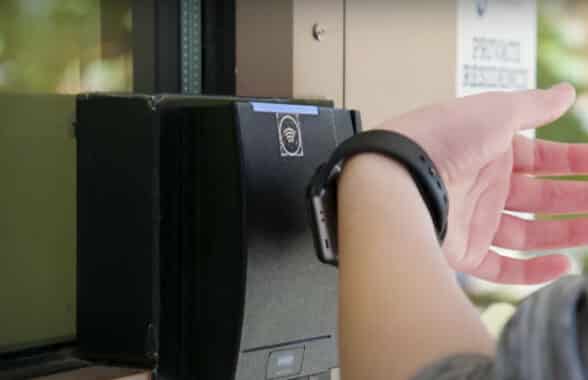 Student at Penn State Using contactless mobile ID on NFC smartwatch