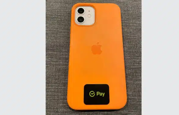 NFC payment sticker on back of iPhone in Russia