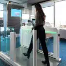 Woman using Air Canada contactless biometric boarding at Vancouver International Airport