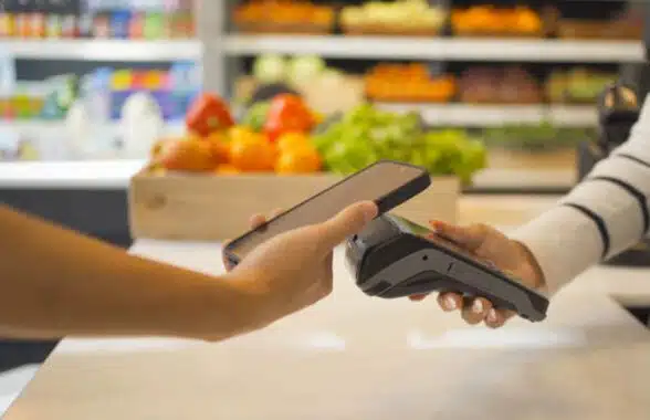 person making contactless mobile payment via US Department of Agriculture SNAP program