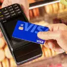 Cashless payment being made using contactless Visa debit card in Singapore