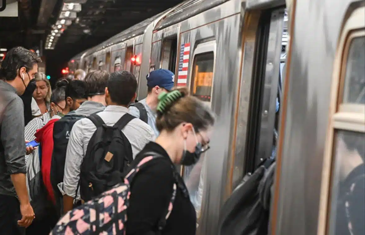 MTA New York subway train with passengers boarding