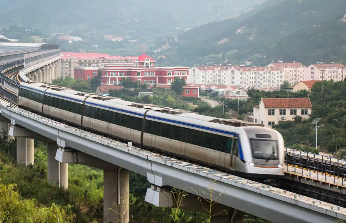 Qingdao metro train travelling over a bridge