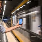 Man using Azienda Mobilità e Trasport (AMT) GoGoGe Mobility-as-a-Service (MaaS) app on Genoa subway