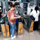Passengers using Omny contactless fare payment system on New York subway