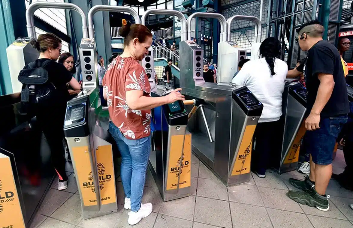 Passengers using Omny contactless fare payment system on New York subway