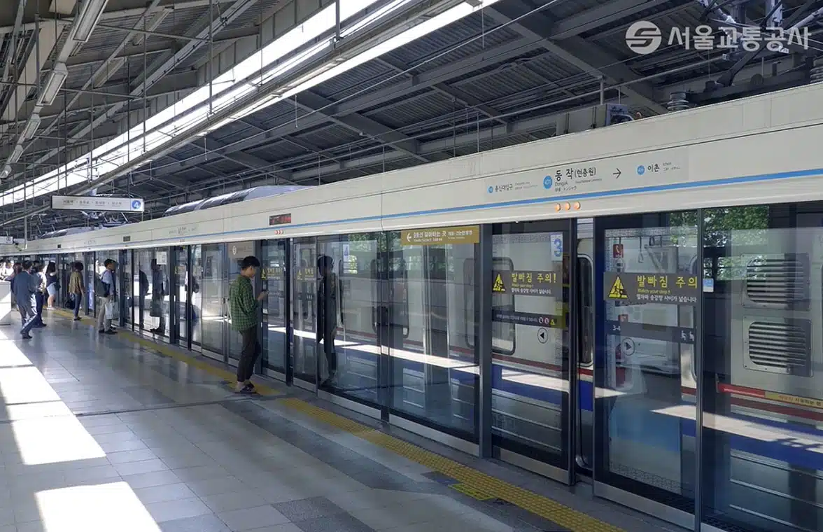 Passengers boarding Seoul Metro subway train in South Korea
