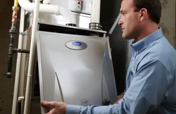 Man installing HVAC system with NFC diagnostics