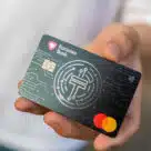 Man holding Eurasian Bank's central bank digital currency debit card in Kazakhstan