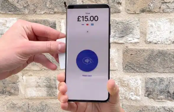 Person making contactless donation on Android phone via Give a little Charity app