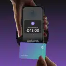 Person using their contactless card to pay on an iPhone equipped with Apple Tap to Pay sPOS in France