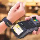 Contactless payment being made using an NFC wristband